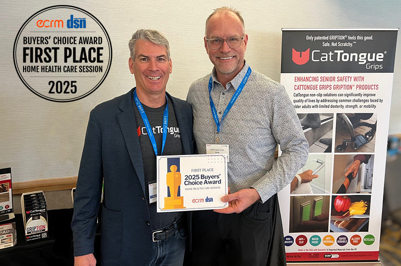 Matt Kelly and Steve Sommers a 2025 Buyers' Choice Award in front of a CatTongue Grips display.