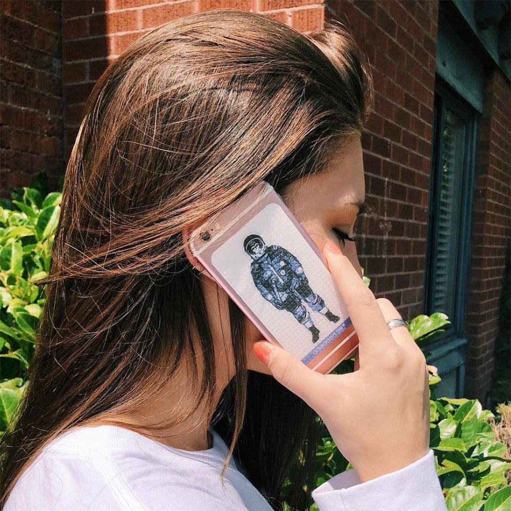 Astronaut monkey inspired cell phone grip